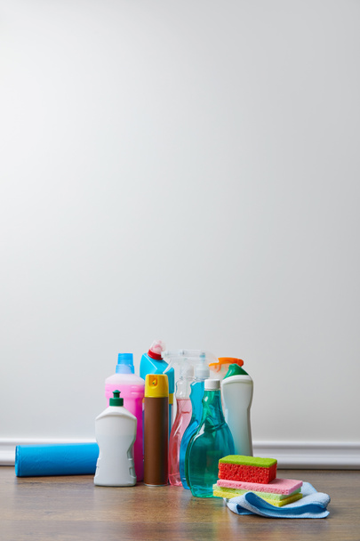 domestic supplies for spring cleaning on wooden floor - 写真・画像