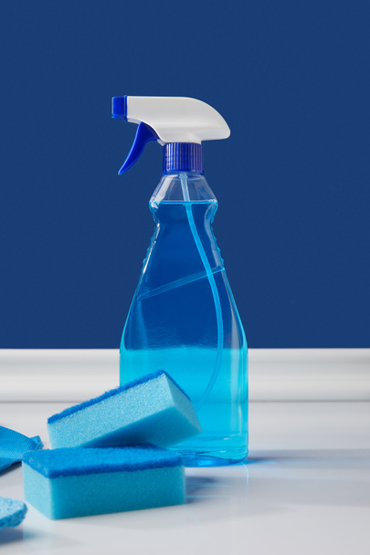 blue spray and washing sponges for spring cleaning - Φωτογραφία, εικόνα