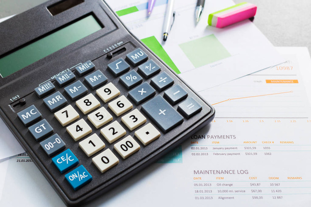 Calculator on business table. Checking accounting report concept - Foto, Imagen