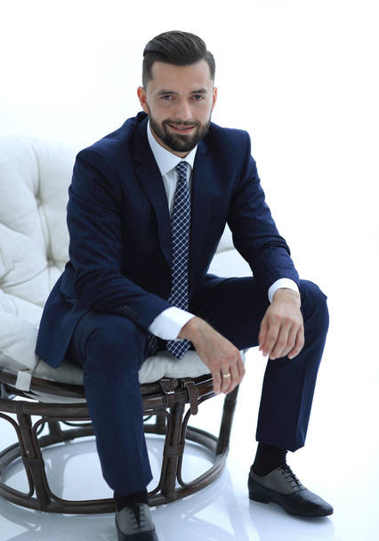 confident businessman sitting in a chair - Foto, afbeelding