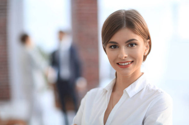 portrait of young business woman on the background of the office - Foto, afbeelding