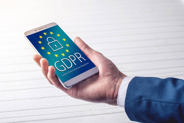 Reglamento General de Protección de Datos RGPD. El texto con la bandera de la UE representado en la tablilla
 - Foto, imagen
