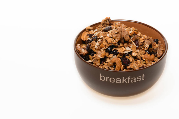 白いれたらに分離された全粒粉ミューズリーの朝食: ボウル - 写真・画像