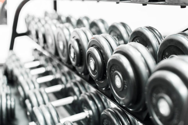Iron dumbbells in the sport gym - Фото, зображення