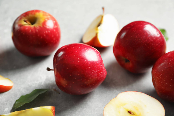 Fresh ripe red apples on light grey background - Φωτογραφία, εικόνα