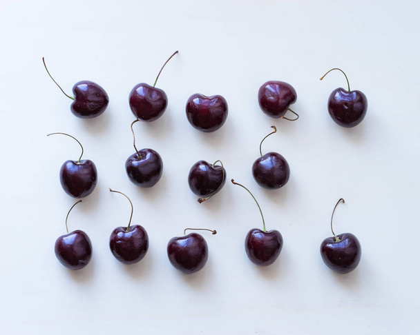Cherry fruit on wooden  white background, - Foto, afbeelding
