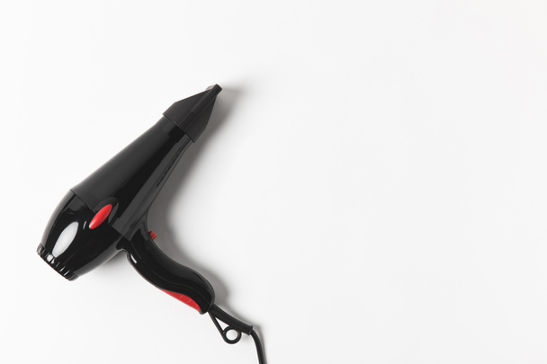 top view of black hair dryer, on white background - Photo, Image