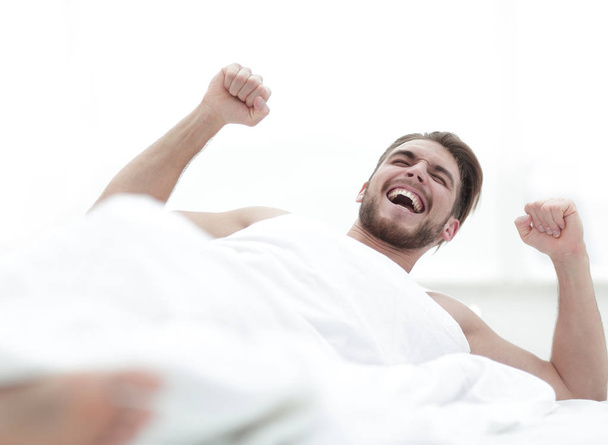 happy man waking up in the morning - Foto, afbeelding