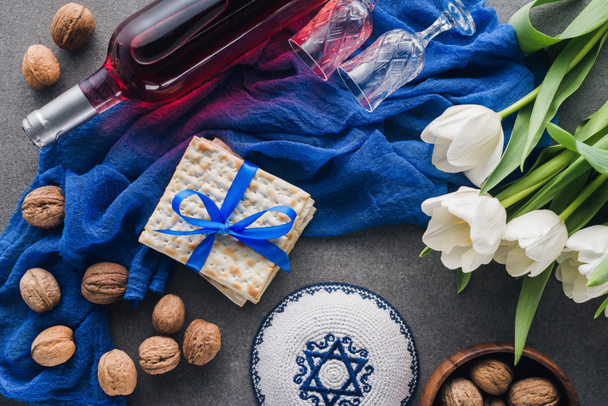 top view of kippah, matza and wine, jewish Passover holiday concept - Photo, Image