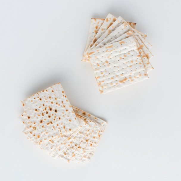top view of matza on white table, jewish Passover holiday concept - Foto, Bild