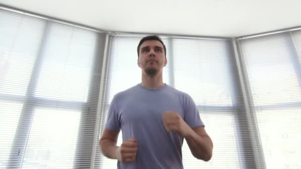 portrait man over 30, on a running simulator,gym, slow mo - Video
