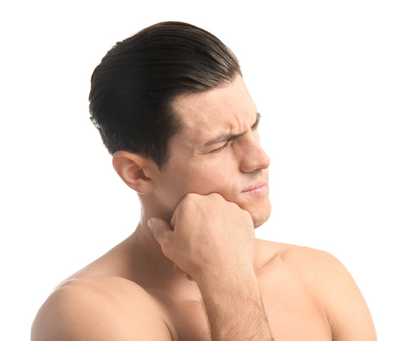 Young man suffering from toothache on white background - Φωτογραφία, εικόνα