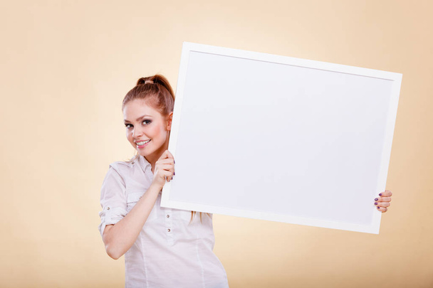 Girl with blank presentation board - Фото, изображение