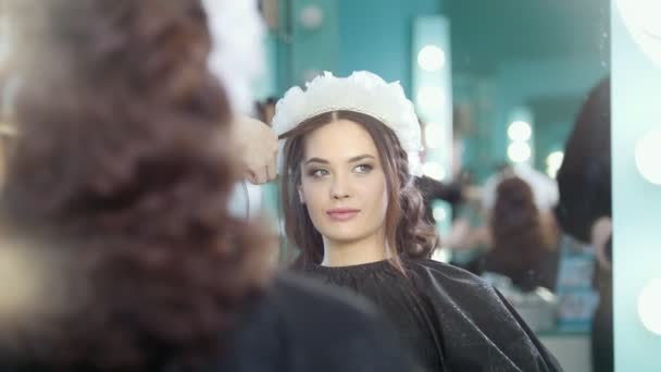 Professional hairstylist making wedding hairstyle - Footage, Video