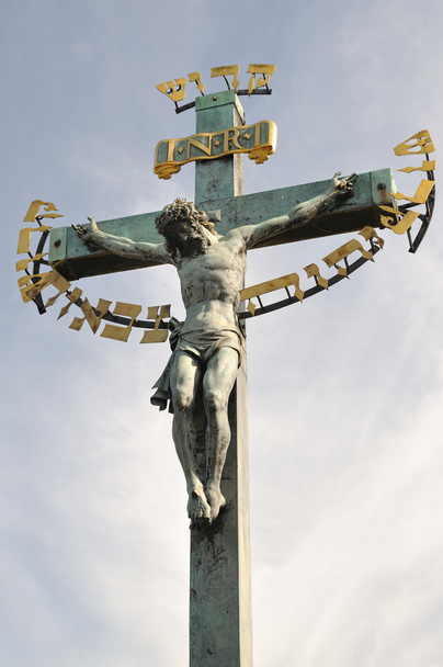 17th Century Crucifixion statue with Hebrew lettering in Charles Bridge Prague - Photo, Image