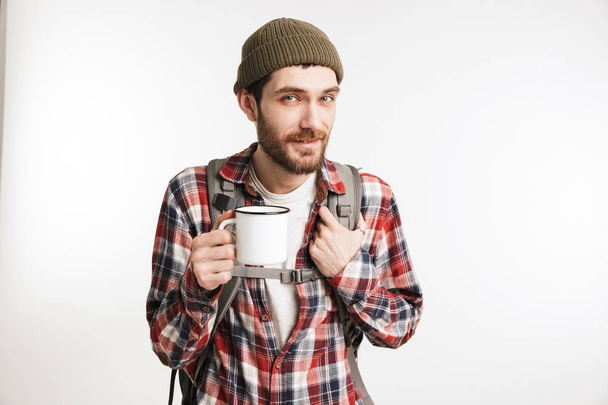 Portrait of a happy bearded man tourist in plaid shirt - Foto, Imagen