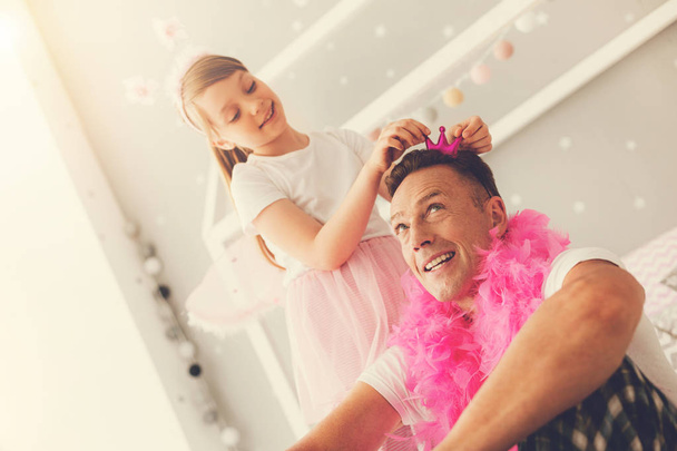 Nice pretty girl enjoying time with her father - 写真・画像