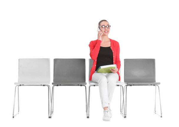 Young woman waiting for job interview on white background - 写真・画像