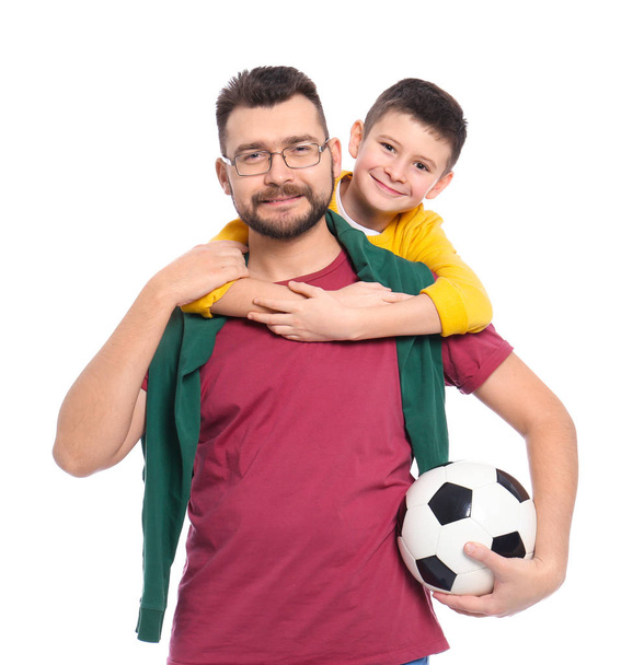 Little boy and his dad with soccer ball on white background - Foto, imagen