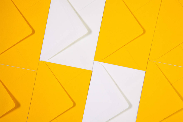 White and yellow envelopes on the  table - Valokuva, kuva
