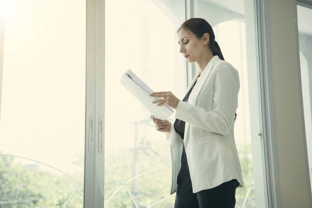 young businesswoman holding file document at office. - Photo, Image