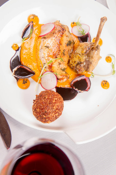 Guinea fowl, pumpkin puree, fried buckwheat, gravy sauce served in a restaurant - Zdjęcie, obraz