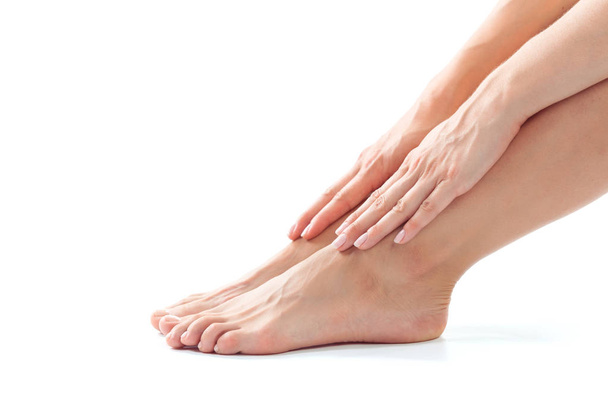 Beautiful women feet isolated on white close-up - Foto, Imagem