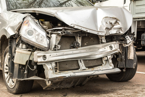 Broken car. White car after the crash. Rusty bumper. - Photo, Image
