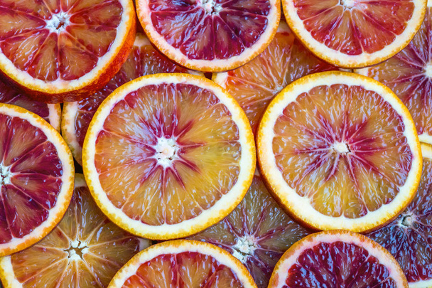 round slices of red orange, background and texture - Fotó, kép