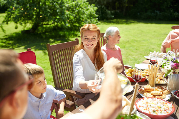 happy family having dinner or summer garden party - Fotoğraf, Görsel