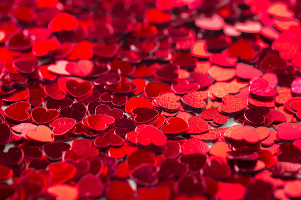 red heart-shaped paillettes - Foto, Imagen
