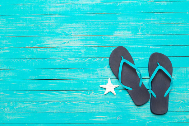 flip-flops on color wooden background - Φωτογραφία, εικόνα
