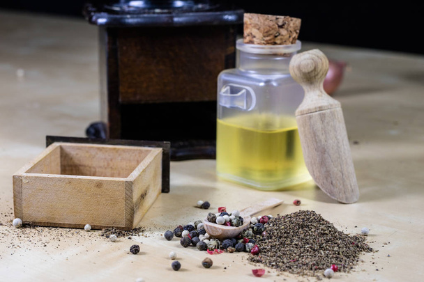 A grain of pepper on a kitchen table. Ground pepper in a kitchen - Φωτογραφία, εικόνα