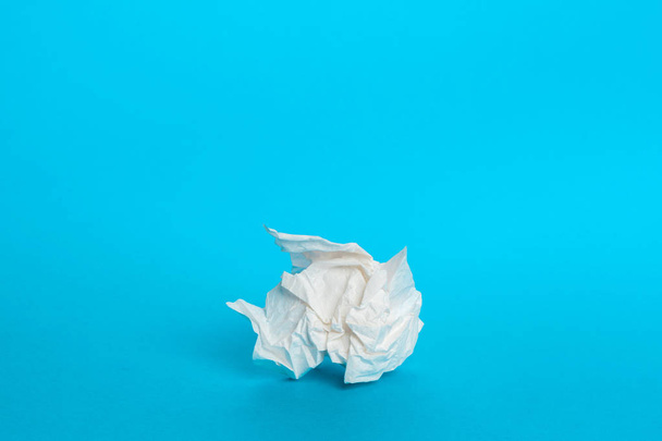 Piece paper napkin on blue background - Фото, изображение