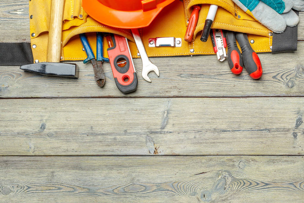 Assorted work tools on wooden table - Fotografie, Obrázek