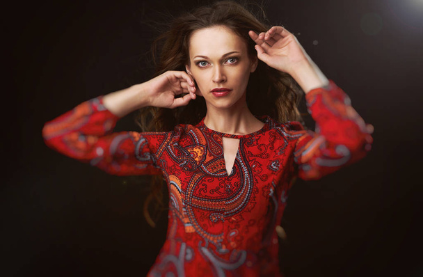 Fashion model woman in red bright dress - Fotó, kép