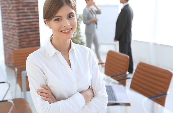 young woman assistant standing near desktop. - Photo, Image