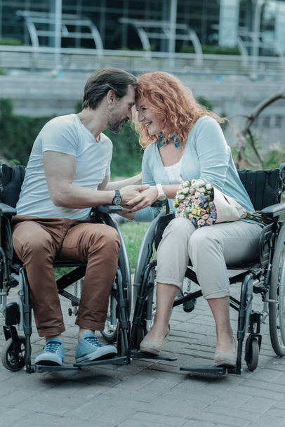 Differently abled people looking at each other - Zdjęcie, obraz