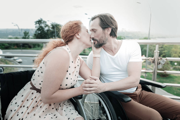 Attractive female person kissing her man - Valokuva, kuva