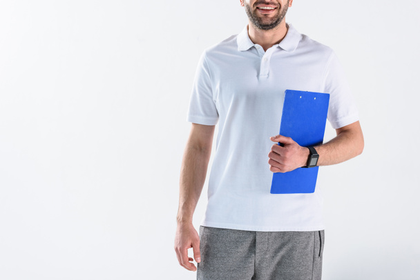 cropped shot of smiling rehabilitation therapist with notepad isolated on grey - Φωτογραφία, εικόνα
