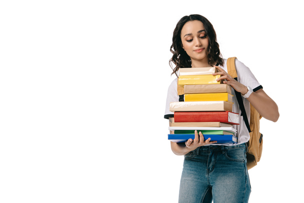 african american teen student looking at books isolated on white - 写真・画像