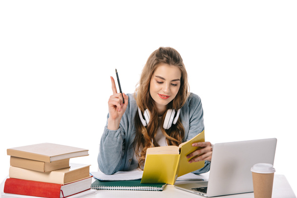 belo estudante mostrando gesto ideia com caneta isolada em branco
 - Foto, Imagem