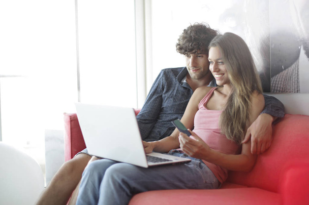 Couple with a laptop - Фото, изображение