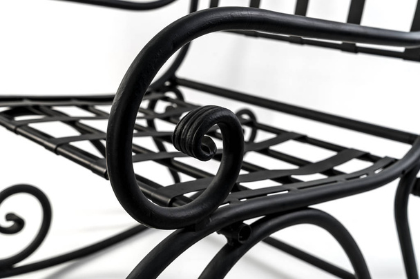 Beautiful curved ornaments of wrought iron. Detail of chair  - Fotografie, Obrázek