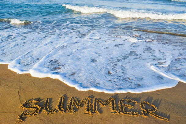 The inscription summer on sand. - Photo, Image