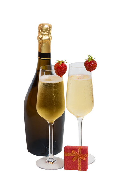 Two glasses of champagne, bottle of champagne and red gift box isolated - Photo, Image