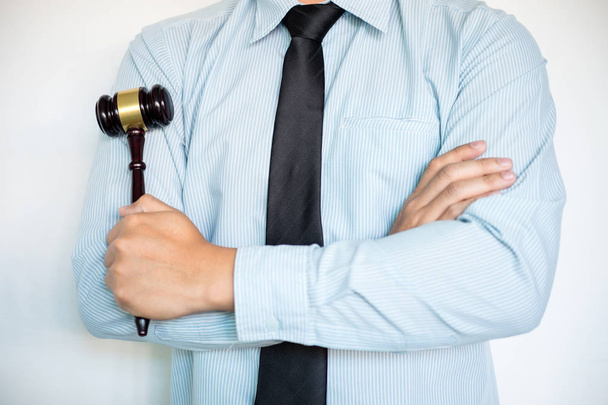 Close-up of Male lawyer with arm crossed standing front backgrou - Foto, Bild