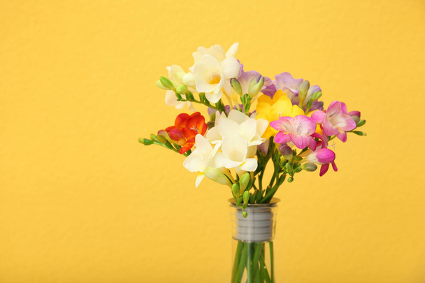 Beautiful freesia flowers on color background - Foto, afbeelding