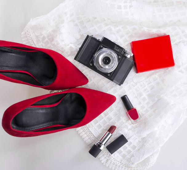 Female elegant outfit shoes, cosmetics and camera - Photo, Image
