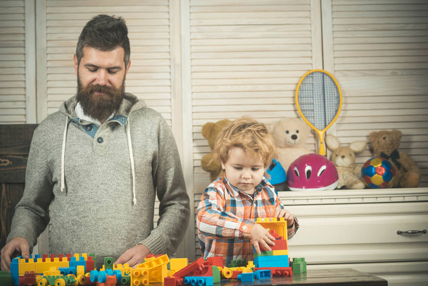 Family play with construction plastic blocks. Family time concept. - 写真・画像